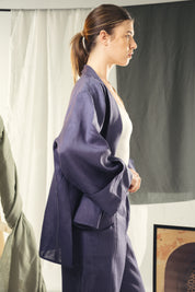 Cardigan with a cut in the sides and collars with curved ends Indigo blue