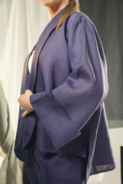 Cardigan with a cut in the sides and collars with curved ends Indigo blue