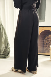 A wide leg copra pants with straw string for adjusting the waist Black