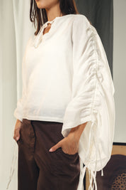 White blouse with straw strings