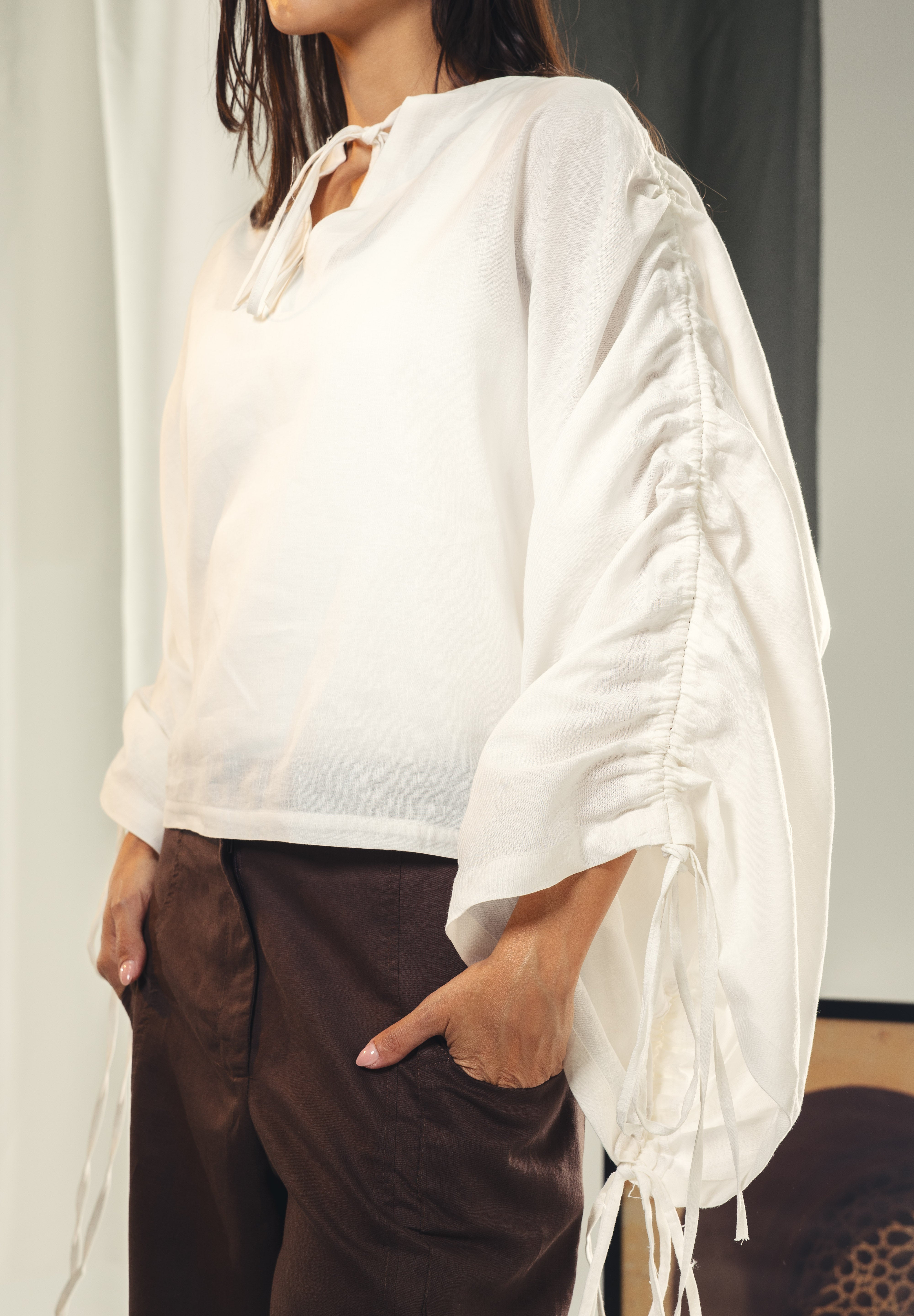 White blouse with straw strings