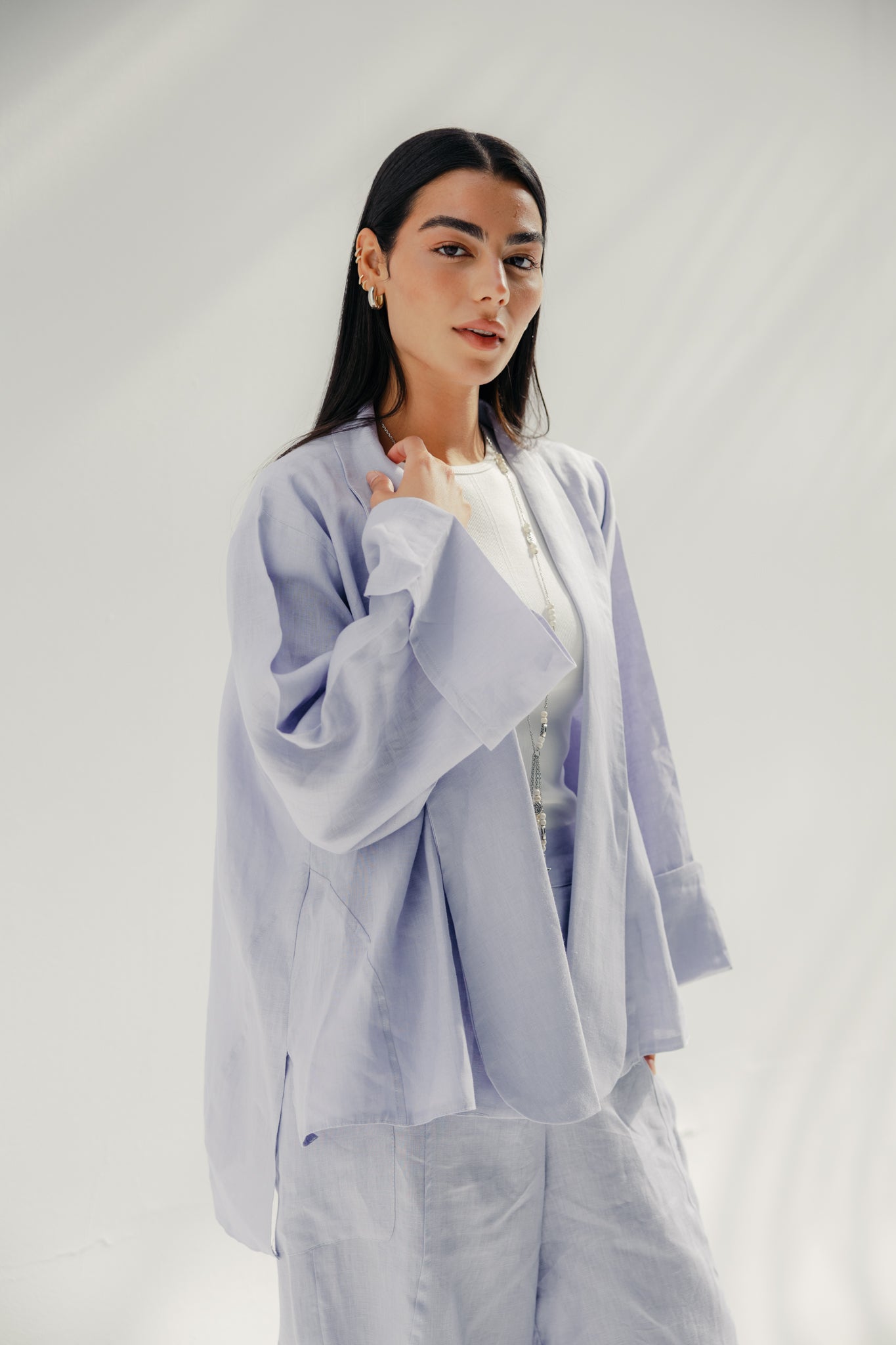 Cardigan with a cut in the sides and collars with curved ends Light Brown