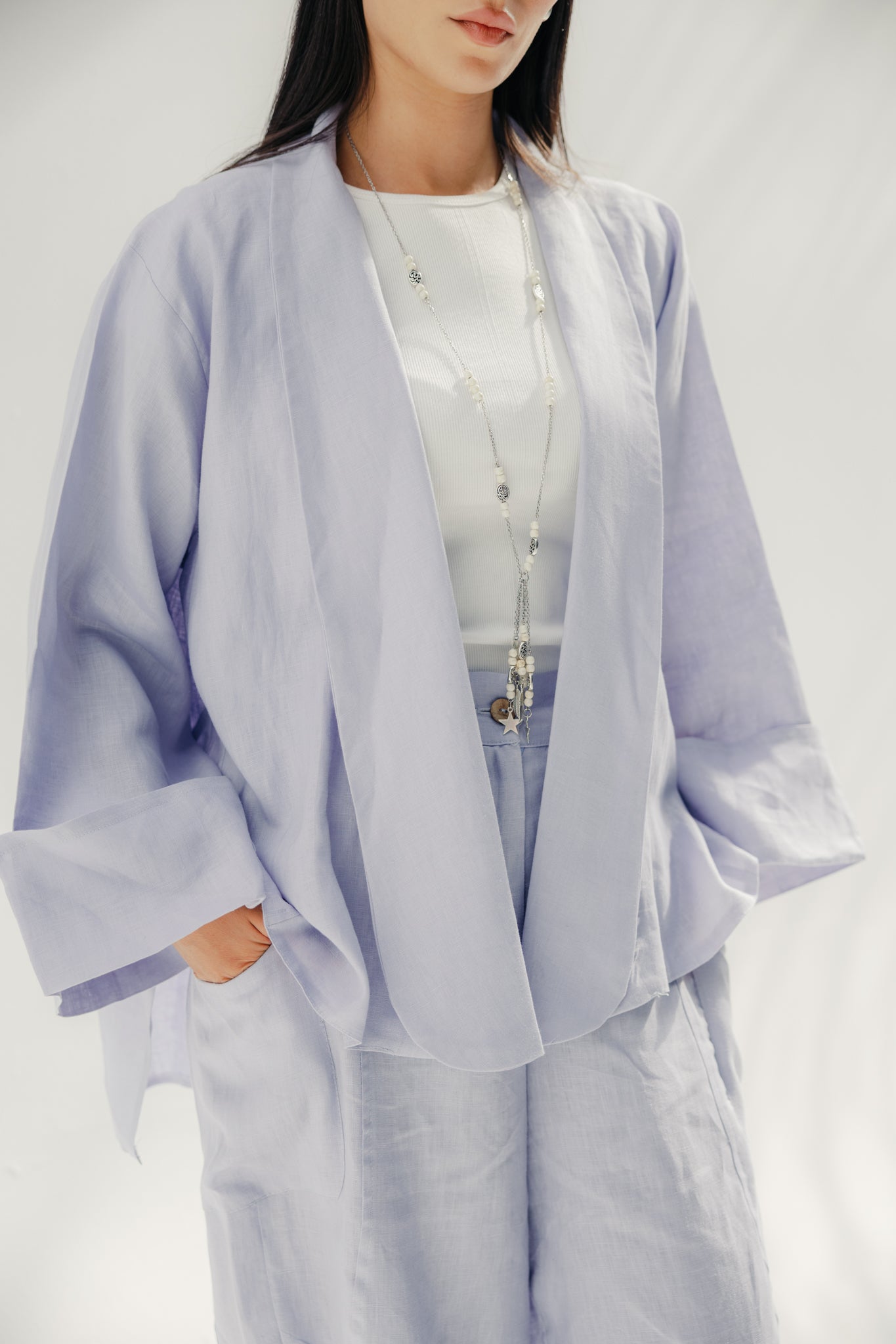 Cardigan with a cut in the sides and collars with curved ends Light Brown