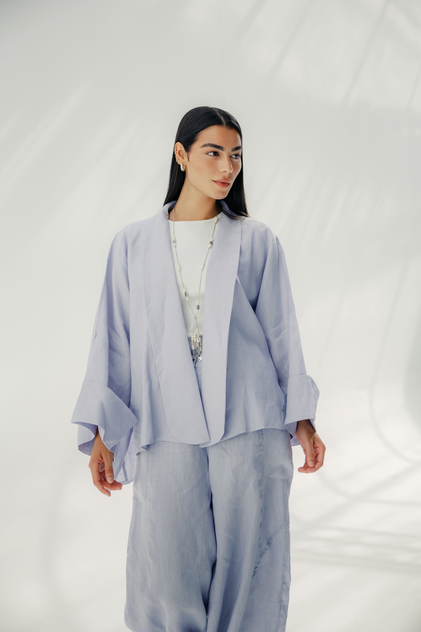 Cardigan with a cut in the sides and collars with curved ends Light Brown